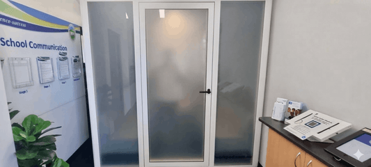 Large office pod with privacy glass in school foyer by workpod