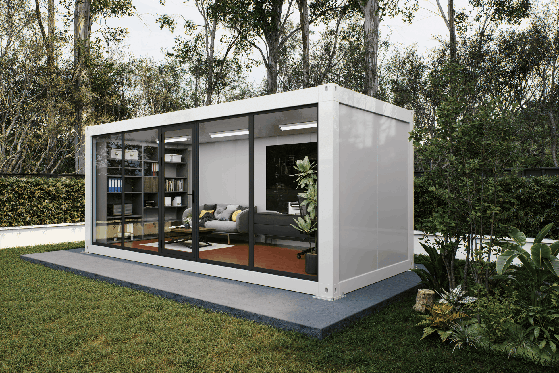 A white modular office container home with large glass windows, shown on a concrete platform in a landscaped garden with trees and grass.
