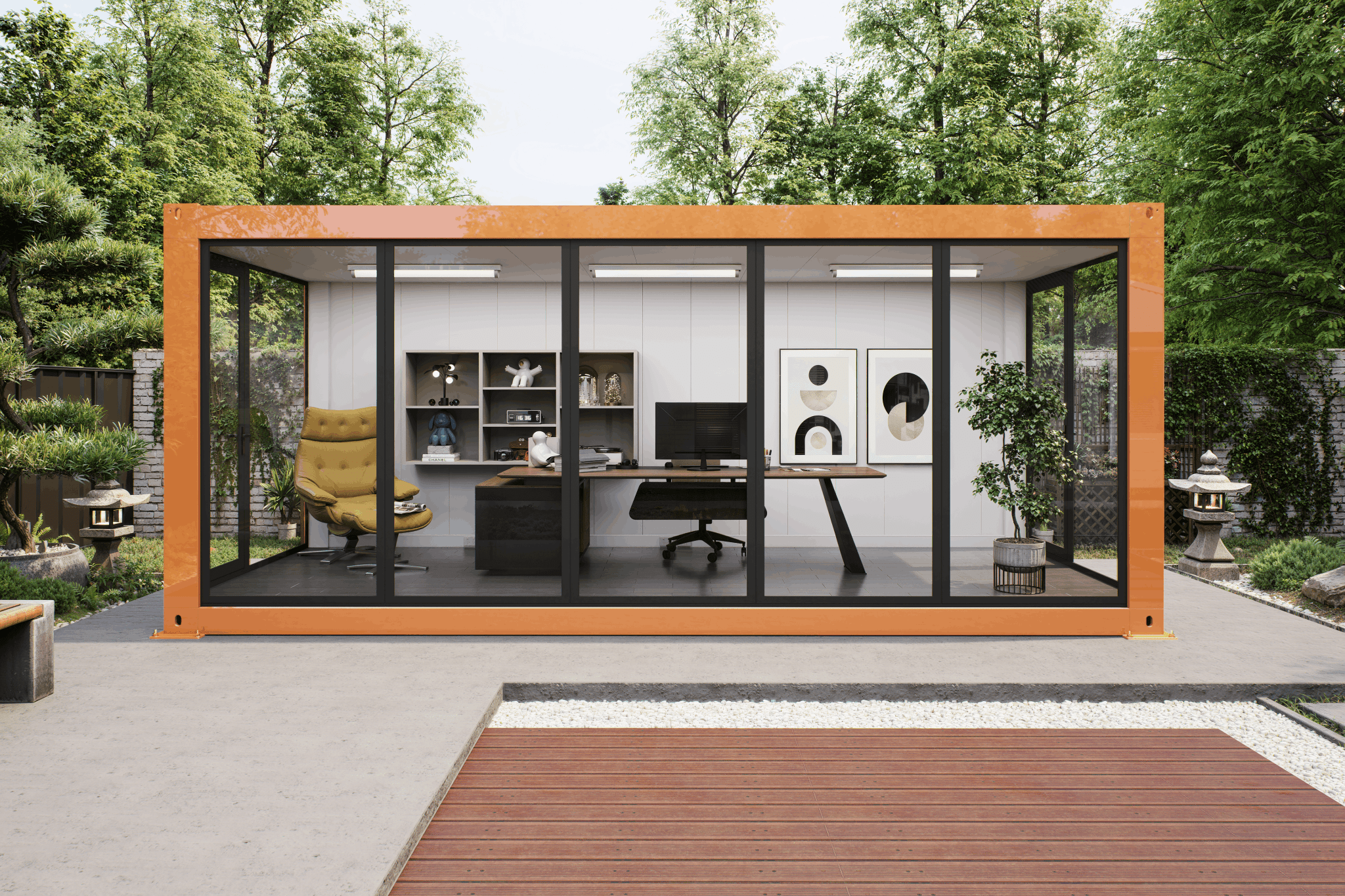 A modern modular office cabin with a bright orange frame and black glass walls, showcasing a furnished interior with a desk, chair, and shelving, set in a landscaped garden courtyard.