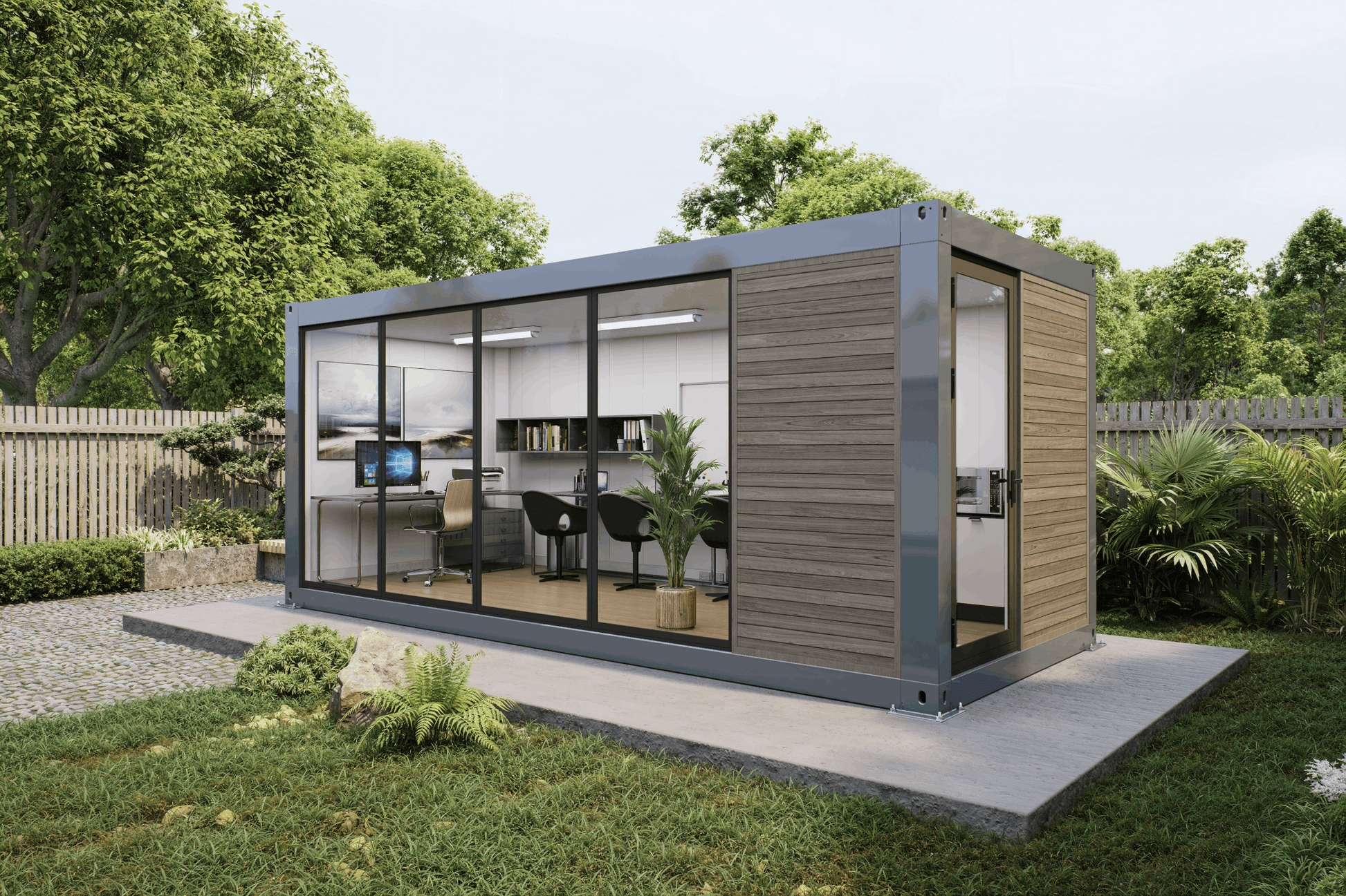 A modern modular office pod with large glass windows, wood-paneled exterior walls, and a gray metal frame, shown on a concrete pad in a landscaped backyard with trees and grass.