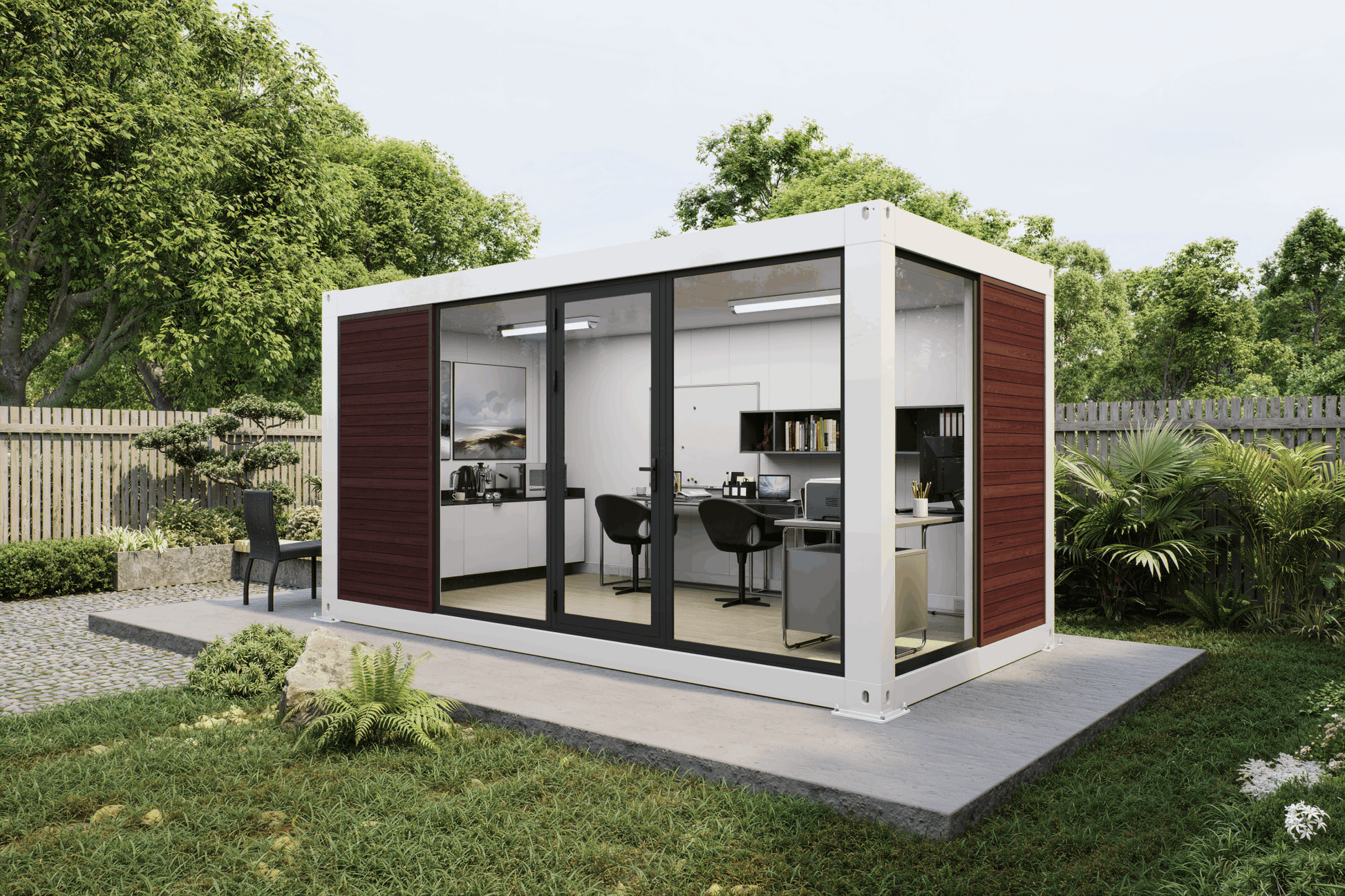 A modern modular office pod with a white container-style frame, dark wood side panels, and large black-framed glass doors, shown installed outdoors on a concrete pad in a landscaped garden with trees and shrubs.