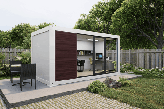 A modern shipping container office pod with a white exterior, dark brown sliding panel, and large glass windows, shown in a landscaped backyard setting.