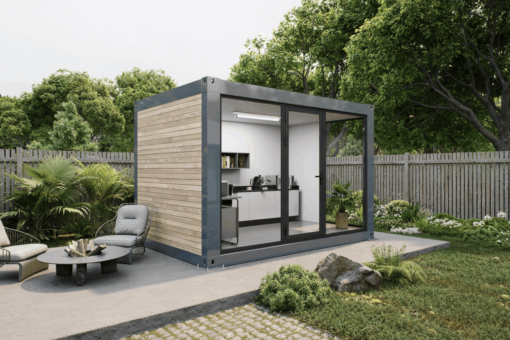 A modern modular container home with a wood-paneled exterior, dark gray metal framing, and large glass sliding doors, shown on a patio in a landscaped backyard with outdoor furniture and trees.